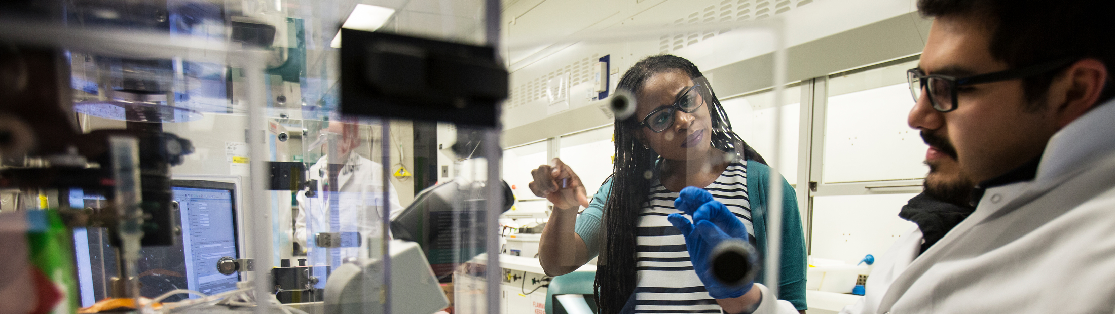 Lola Eniola-Adefeso in a lab with a colleague