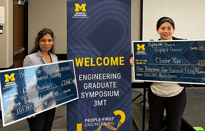 Kumari and Yin pictured with awards